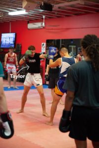 Krudar Muay Thai instructor Taylor teaching a beginners class